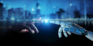 Human hand and robotic hand reaching toward each other with glowing touch