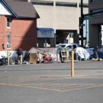 Owners Win—Squatters Stay? Maryland Madness Homeless encampment with tents along a city street
