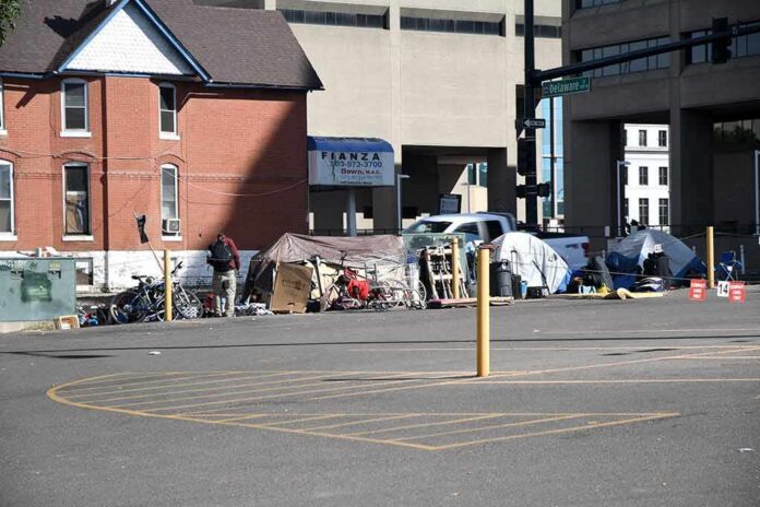 Homeless encampment with tents along a city street