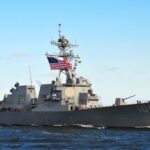 The Ceasefire That Lasted a Month — Now Both Sides Are Attacking Again naval destroyer with flags sailing on open water