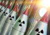River Crash Halts Reactor — City Darkens Row of missiles with radiation symbols and red tips