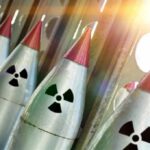 Row of missiles with radiation symbols and red tips