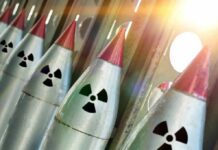 Row of missiles with radiation symbols and red tips