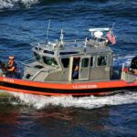 U.S. Coast Guard patrol boat speeding on open water