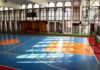 Federal Crackdown Hits School District Indoor basketball court with blue floor and orange key areas