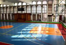 Federal Crackdown Hits School District Indoor basketball court with blue floor and orange key areas