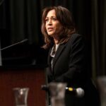 Point Dume Purchase, Hypocrisy Claims Erupt Woman speaking at a podium with microphone