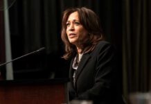 Woman speaking at a podium with microphone