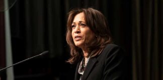 Woman speaking at a podium with microphone