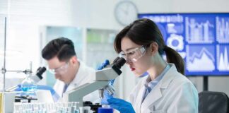 Scientist using a microscope in a modern laboratory