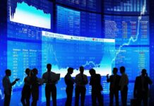 Nike’s Patriotic Backfire Haunts Wall Street Silhouetted business professionals in front of digital stock market displays