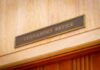 Blue-State Crackdown Meets Defiant Sheriff Governor's Office sign above a wooden doorway