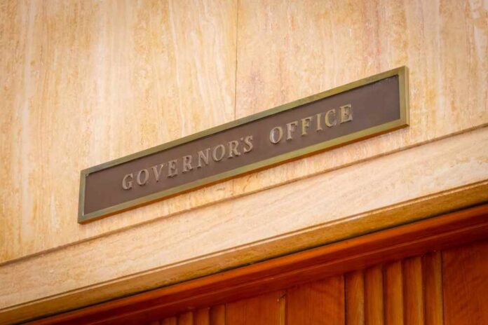 Governor's Office sign above a wooden doorway