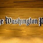 Arbitrator Says Washington Post Went Too Far The Washington Post logo on a wooden wall