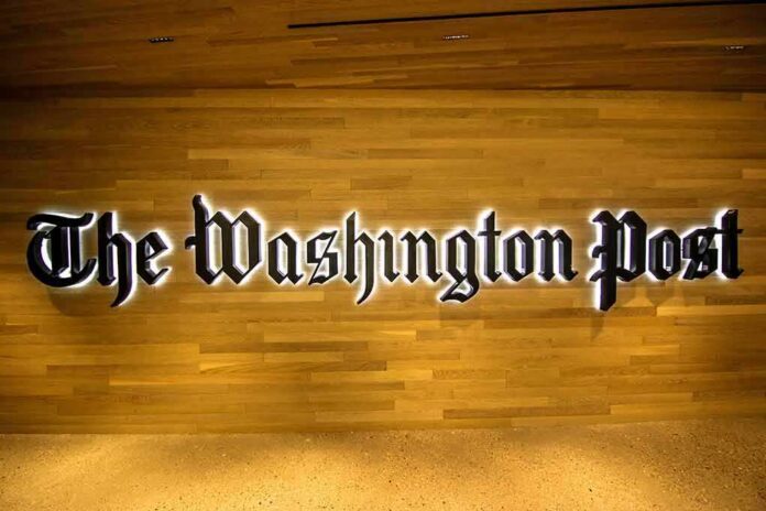 shutterstock_681778504 The Washington Post logo on a wooden wall