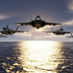 Cockpit-Tail Hit: The Unthinkable Play Five jets flying low over the ocean at sunset.