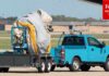 JUST IN: Workers Carry Away Emergency Slide From Air Force One After Deployment
