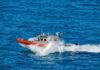 coast guard patrol boat speeding across open ocean