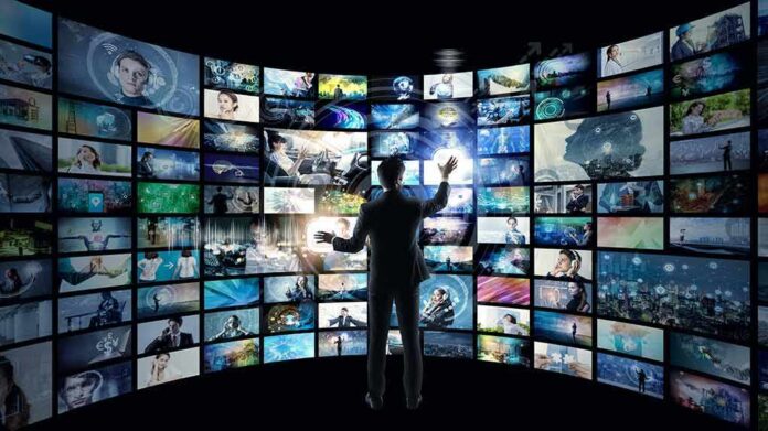 Person interacting with curved wall of digital screens