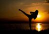 Wonder Woman Hype, Real Issues Vanish silhouette of a person doing a high kick at sunset by a lake