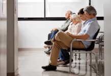Terrifying Spike Hits 25 – 44 – Not A Blip people sitting in a waiting room