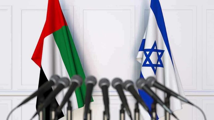 shutterstock_1254441925 UAE and Israel flags behind microphones