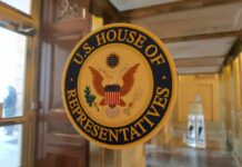 U.S. House of Representatives seal on a glass door
