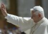 Pope waving to a crowd during a public appearance