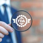 Gold Cybertruck Exposes VA Therapy Scam Magnifying glass held by person in suit showing FDA badge icon