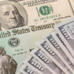 Choking Off the Cash That Funds Illegal Employment U.S. Treasury check and hundred-dollar bills