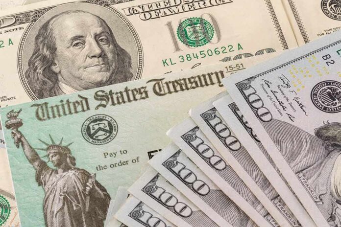U.S. Treasury check and hundred-dollar bills