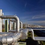 Industrial pipelines at a processing plant under blue sky