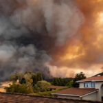 The Smoke That Turned Toronto’s Sky Orange — And the Pattern Behind It Wildfire smoke billows over suburban houses