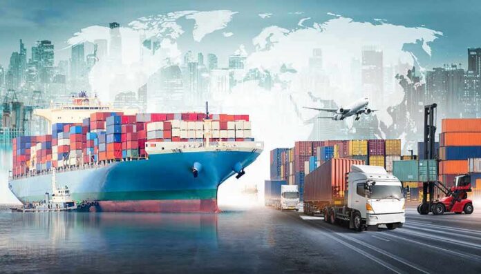 shutterstock_1827572390 Cargo ship with containers alongside trucks, plane, and forklifts at a port