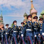 Brian Folkerts among uniformed cadets marching in Red Square