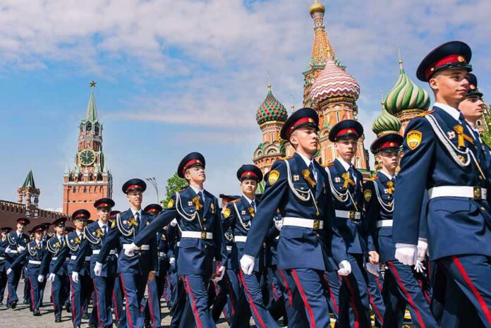 Brian Folkerts among uniformed cadets marching in Red Square