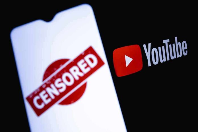 smartphone screen with censored stamp next to YouTube logo