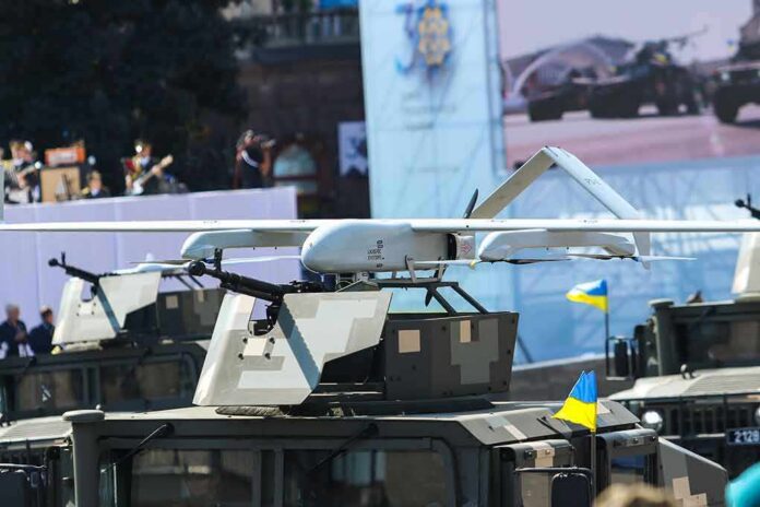 shutterstock_2034373115 Military drone mounted on armored vehicle