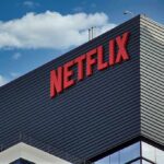 Paramount Accuses Netflix of “Poisoning” the Warner Bros. Deal Netflix logo on modern office building exterior