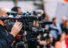 Trump Renames A Great Lake — Chaos Ensues Video cameras on tripods at a media event