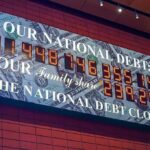 IBM’s CEO Admitted the Company “Faltered” — The AI Hardware Rush Is Why national debt clock sign with digital numbers