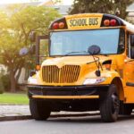Yellow school bus with stop sign extended