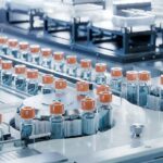 Mpox Vials On Packed Flight—From Outbreak Zone Pharmaceutical vials on an automated production line