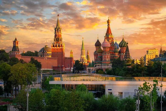 shutterstock_2453703231 St. Basil's Cathedral and Kremlin towers at sunset