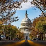 Billion-Dollar Hangover From One Old Carrier United States Capitol dome framed by a tree-lined street