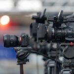 Courtside Clout Chasers Trigger U.S. Open Pause Professional video cameras on tripods