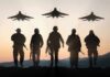 Chants Erupt As Air Force One Screams Over Soldiers walking with fighter jets flying overhead at sunset