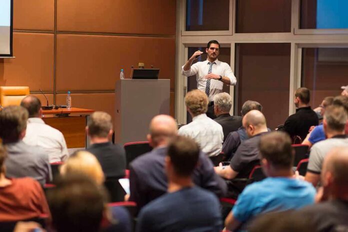 Speaker addresses audience in a conference room