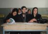 Sihem Habchi and other women seated at a classroom desk