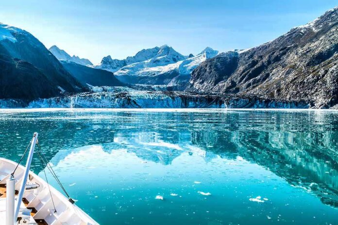 shutterstock_556662694 Boat approaching a glacier in a turquoise fjord